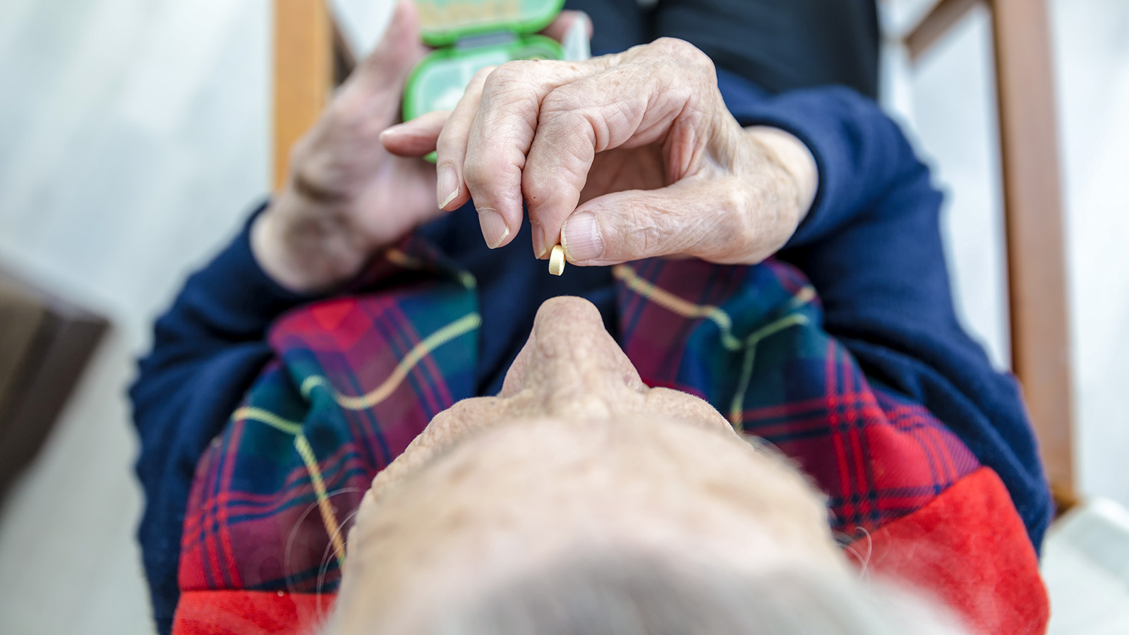 Pensioners taking medication (Photograph: Shutterstock).