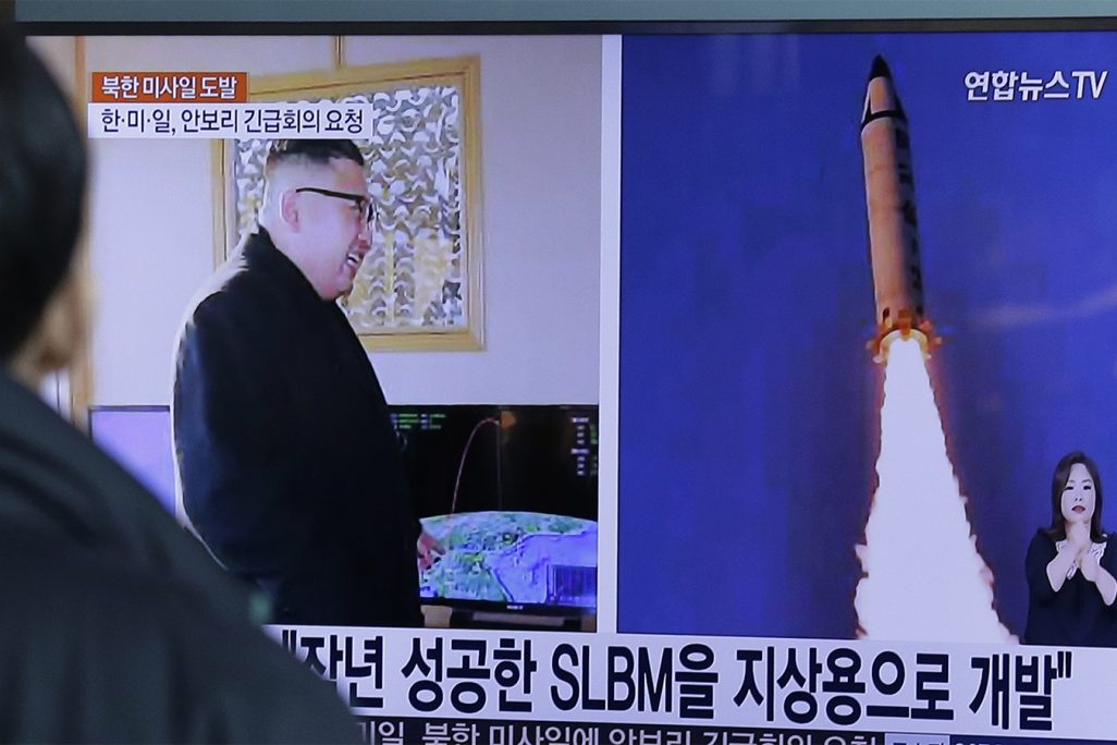 A man watches a TV news program showing photos published in North Korea's Rodong Sinmun newspaper of North Korea's "Pukguksong-2" missile launch and North Korean leader Kim Jong Un at Seoul Railway Station in Seoul, South Korea, Monday, Feb. 13, 2017. In an implicit challenge to President Donald Trump, North Korea fired a ballistic missile early Sunday in its first such test of the year. The letters read "Submarine-Launched Ballistic Missiles developed for ground use." (AP Photo/Ahn Young-joon)
