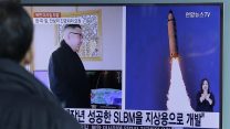 A man watches a TV news program showing photos published in North Korea's Rodong Sinmun newspaper of North Korea's "Pukguksong-2" missile launch and North Korean leader Kim Jong Un at Seoul Railway Station in Seoul, South Korea, Monday, Feb. 13, 2017. In an implicit challenge to President Donald Trump, North Korea fired a ballistic missile early Sunday in its first such test of the year. The letters read "Submarine-Launched Ballistic Missiles developed for ground use." (AP Photo/Ahn Young-joon)