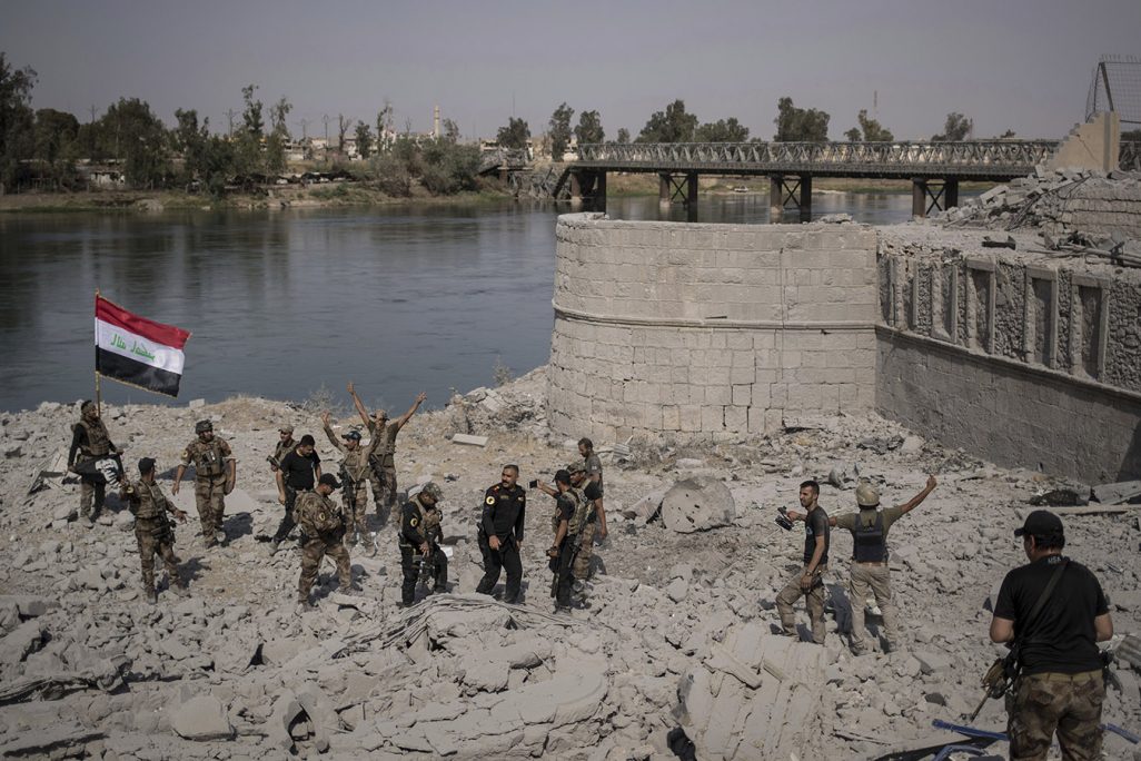 Iraqi Special Forces soldiers celebrate after reaching the bank of the Tigris river as their fight against Islamic State militants continues in parts of the Old City of Mosul, Iraq, Sunday, July 9, 2017. (AP Photo/Felipe Dana)