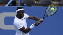Frances Tiafoe returns the ball against Hubert Hurkacz, of Poland, during the Citi Open tennis tournament, Wednesday, Aug. 1, 2018, in Washington. (AP Photo/Nick Wass)