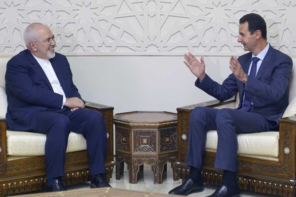 שר החוץ האיראני זריף בפגישה עם נשיא סוריה באשר אסד. 3 בספטמבר 2018 (SANA via AP)