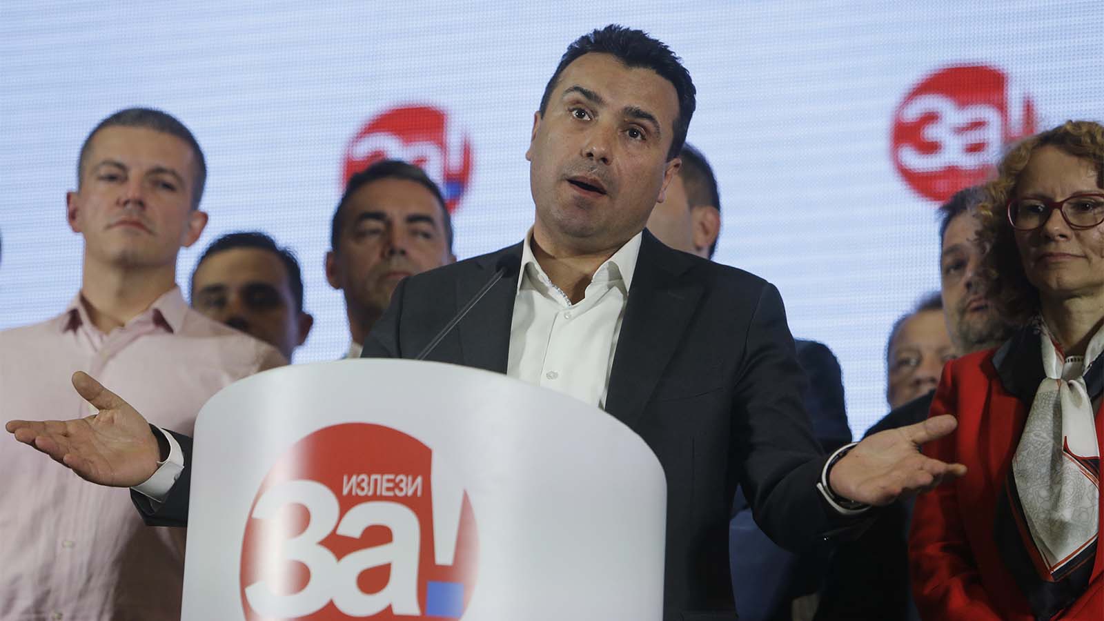 Macedonia's Prime Minister Zoran Zaev gestures as he talks to members of the media about the referendum in Skopje, Macedonia, late Sunday, Sept. 30, 2018. The crucial referendum on accepting a deal with Greece to change the country's name to North Macedonia to pave the way for NATO membership attracted tepid voter participation Sunday, a blow to Zaev's hopes for a strong message of support. (AP Photo/Boris Grdanoski)