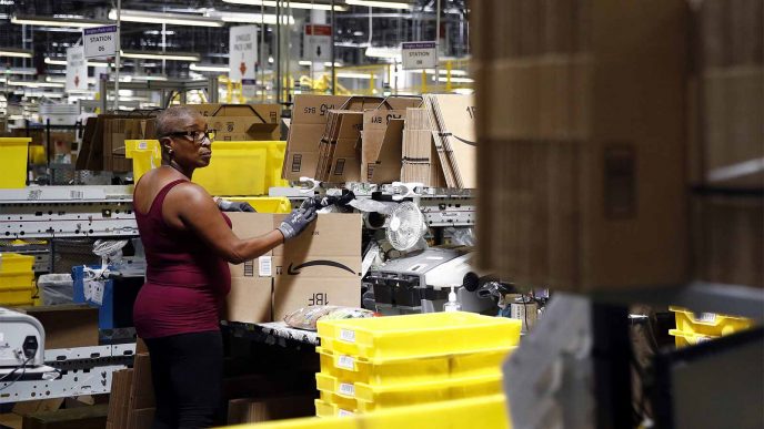Cynthia Richburg prepares a product for shipment at an Amazon fulfillment center in Baltimore. (AP Photo/Patrick Semansky, File)