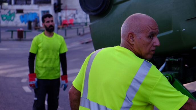 Roei Shalev and Doron Barzelai do their rounds as the trash collection truck team.. Credit: David Twersky.