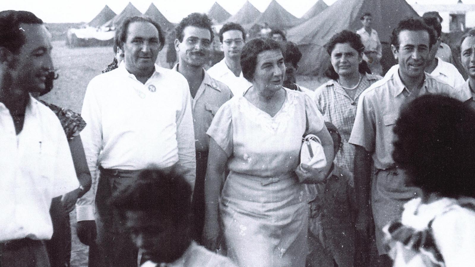 Golda Meir visiting a transit camp, 1950