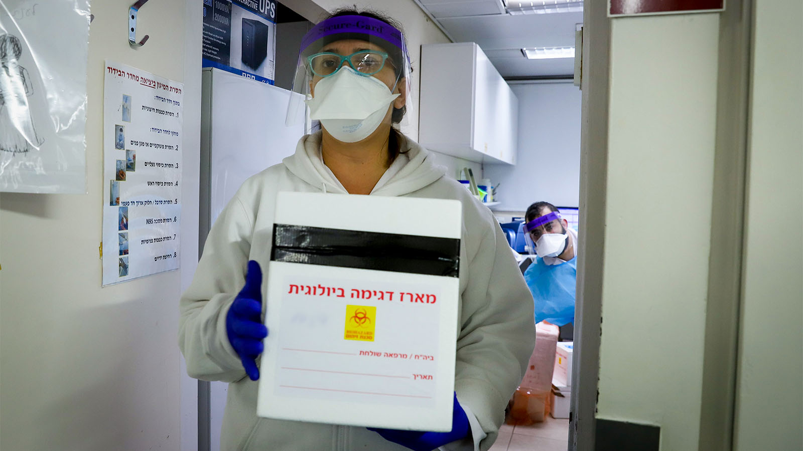 A sample from a patient suspected of COVID-19 is tested at a laboratory. (Photo: Yosi Aloni/Flash90)