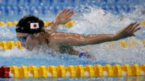איקה ריקאקו היפנית במשחה 100 מטר בפרפר (AP Photo/Lee Jin-man) (AP Photo/Lee Jin-man)