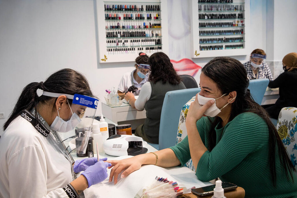 Women getting their nails done at a beauty salon in Jerusalem on April 26, 2020. Photo by Nati Shohat/Flash90
