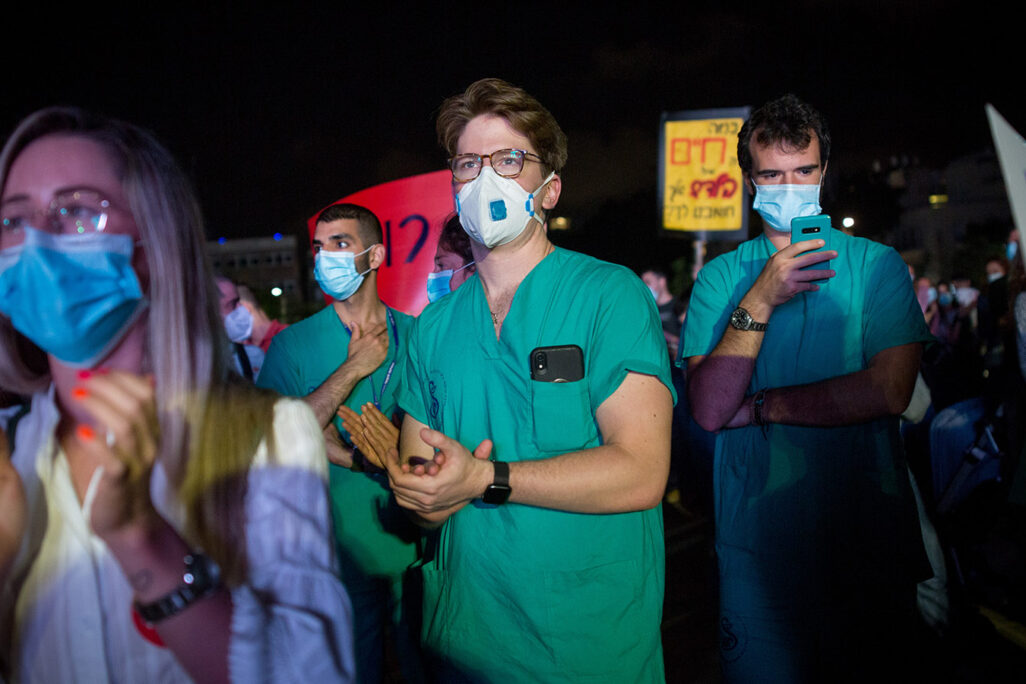 Medical interns demonstrate for better work conditions at Habima Square in Tel Aviv on May 9, 2020. Photo by Miriam Alster/Flash90