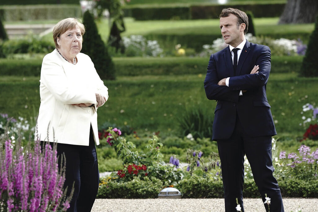 קנצלרית גרמניה אנגלה מרקל ונשיא צרפת עמנואל מקרון, ביוני 2020. "(Kay Nietfeld/dpa via AP)