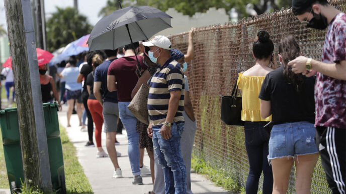People waiting in line to get tested for COVID-19. July 16 2020, USA (AP Photo/Lynne Sladky)
