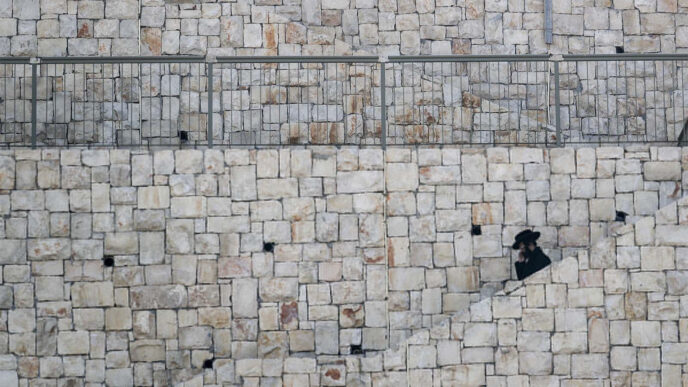 Man walking down the stairs in Beitar Illit. (Photo: Nati Shohat/Flash90)