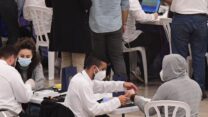 צמיד אלקטרוני לחוזרים מחו"ל (צילום: תומר ניוברג/פלאש90)