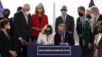 House Speaker Nancy Pelosi of Calif., signs the $1.9 trillion COVID-19 relief bill, accompanied by Senate Majority Leader Chuck Schumer of N.Y., during an enrollment ceremony on Capitol Hill, Wednesday, March 10, 2021, in Washington. (AP Photo/Alex Brandon)