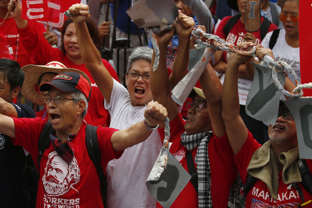 פעילי זכויות עובדים בפיליפינים (צילום: (AP Photo/Bullit Marquez)