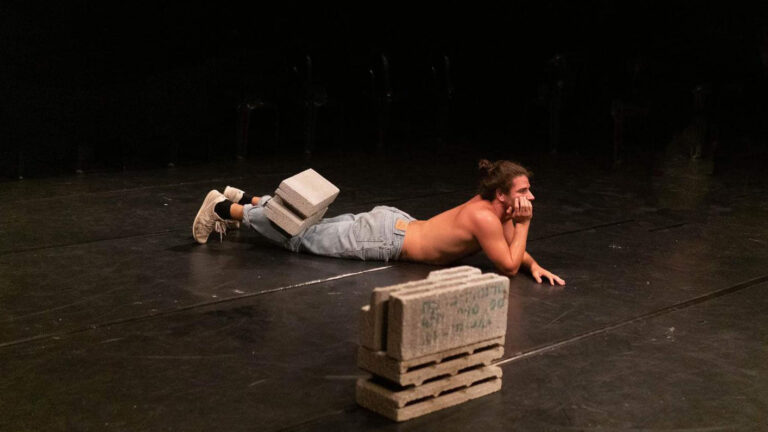 Eirad Ben Gal performing in “Building Downwards &#8211; Duet with a Concrete Block.” (Photo: Private album)