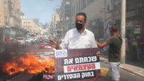 רועי כהן, נשיא להב בהפגנת העצמאיים (צילום: גדעון מרקוביץ)