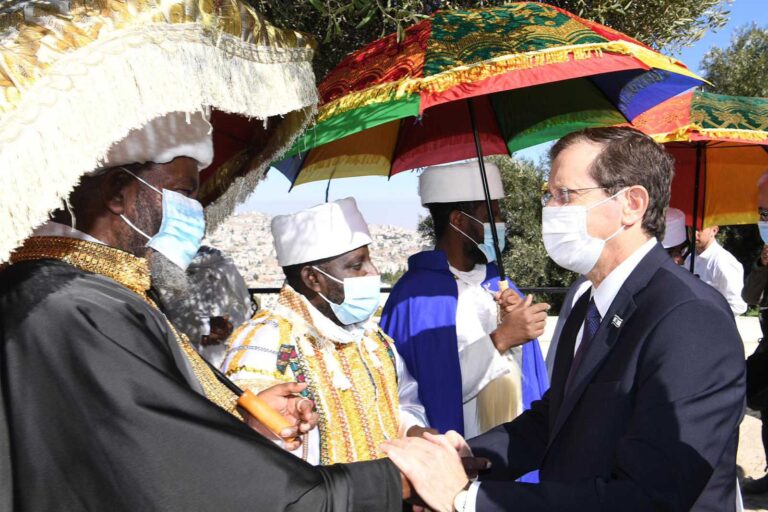 President Isaac Herzog shaking hands with the kessim (religious leaders in the Ethiopian Jewish community). (Photo: Amos Ben Gershom)