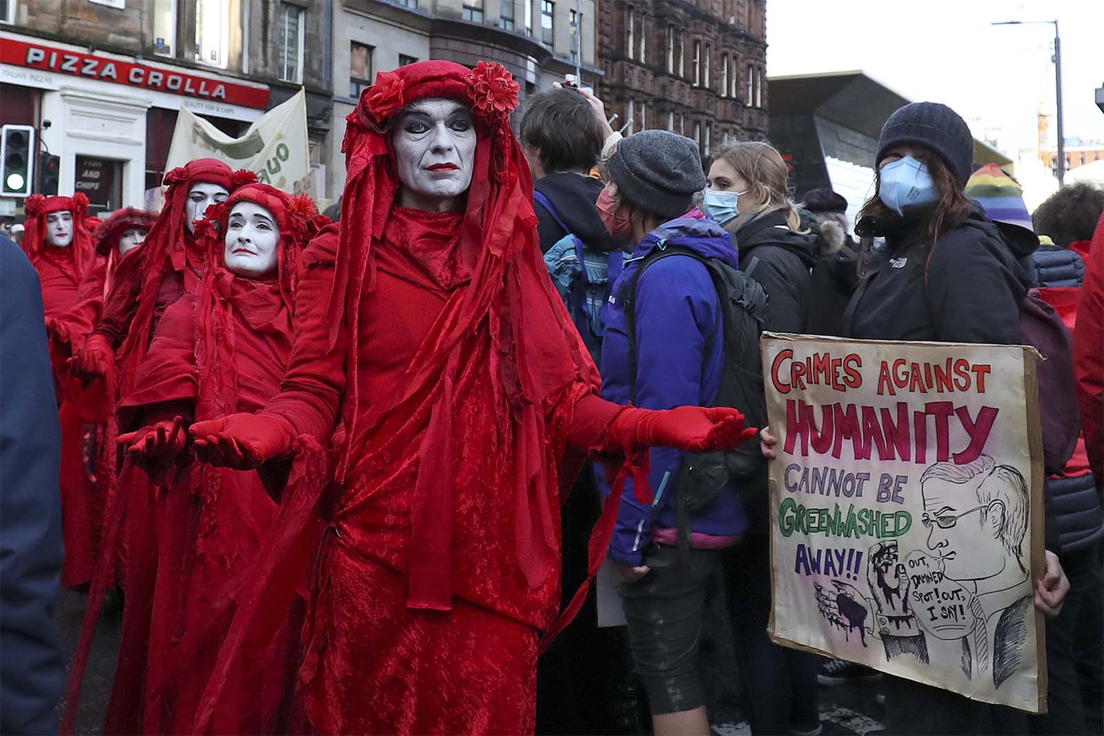 מפגינים מול ועידת האקלים בגלזגו (צילום: AP Photo/Scott Heppell)