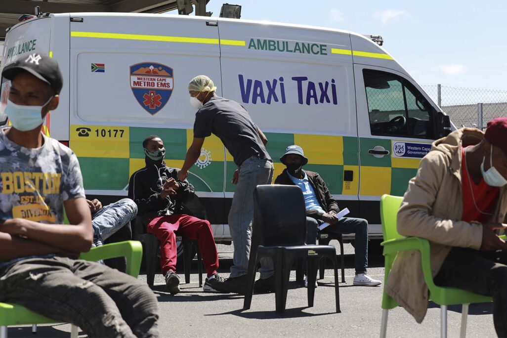 People wait to be vaccinated at a mobile "Vaxi Taxi" which is an ambulance converted into a mobile COVID-19 vaccination site in in Cape Town, South Africa. (Photo: AP/Nardus Engelbrecht)