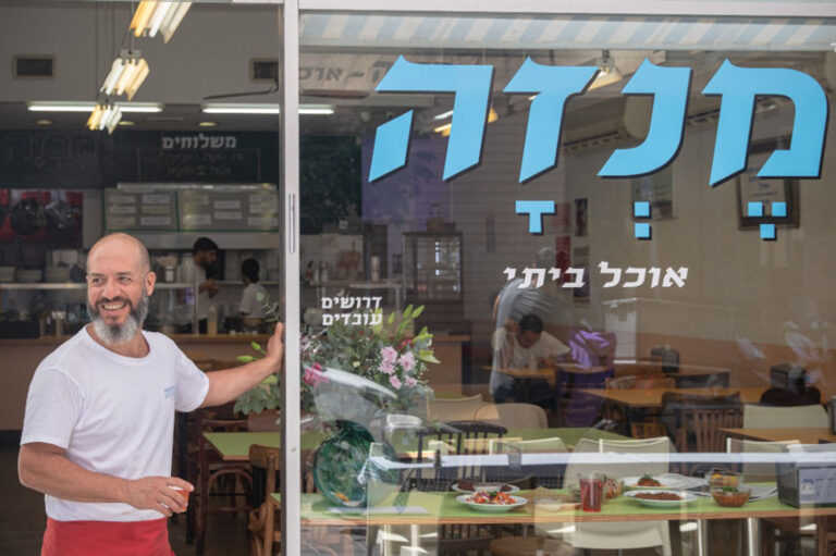 Roey Shadur standing at the entrance to his restaurant, Menza: “The workers and I are in the same boat.” (Photo: Yonatan Ben Haim)