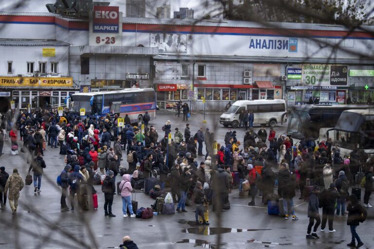 People try to get onto buses to leave Kyiv, Ukraine, Thursday, Feb. 24, 2022. (Photo: AP Photo/Emilio Morenatti)