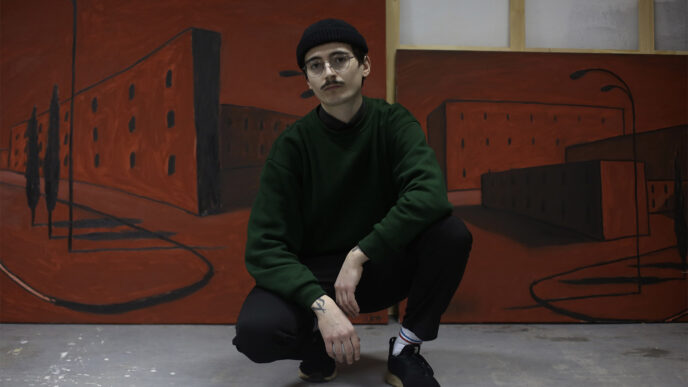 Bohdan Sokur poses next to one of his paintings.(Photo: Anastasia Maximova)