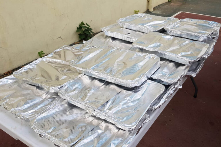 Trays of food for the Iftar meal. People can get three meals a day at the Ajami Youth Center for free. (Photo: Ahmad Hasona)