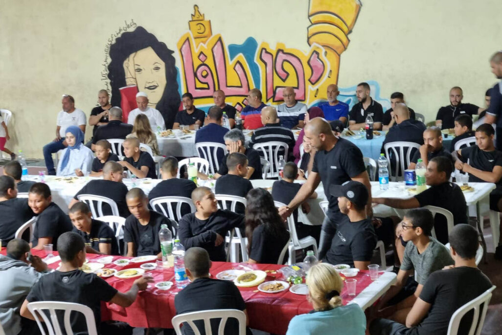 Iftar meal at a youth center. “I know what the youth did yesterday, but today he’s here, and I will give him everything that I can.” (Photo: Ahmad Hasona)
