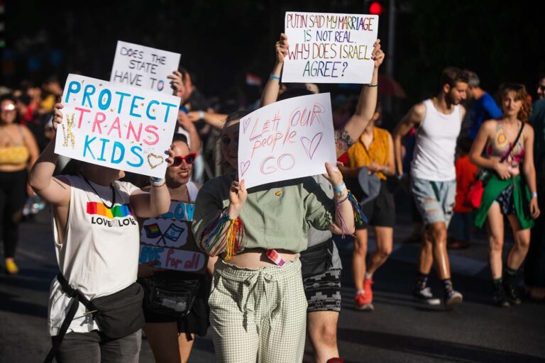 “Protect Trans Kids,” “Let our people GO,” “Putin said my marriage is not real. Why does Israel agree?” (Photo: David Frenkel)