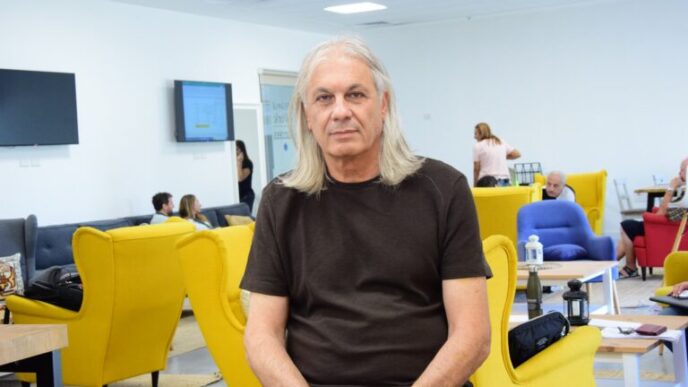 Max Sivan, principal of Amal Peres High School, in one of the school's seating areas. "The relationship between the teaching staff and the students is based on trust" (Photo: Or Guetta)