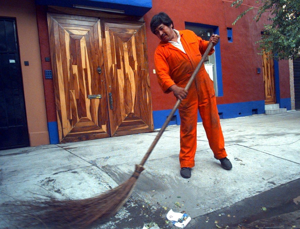 A street cleaner in Mexico (Photo by Joe Cavaretta/AP).