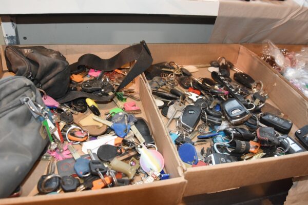 Keys of houses and vehicles. Volunteers and police officers sort the items and gather photographs of each item in a binder. (Photo: Hadas Yom Tov)