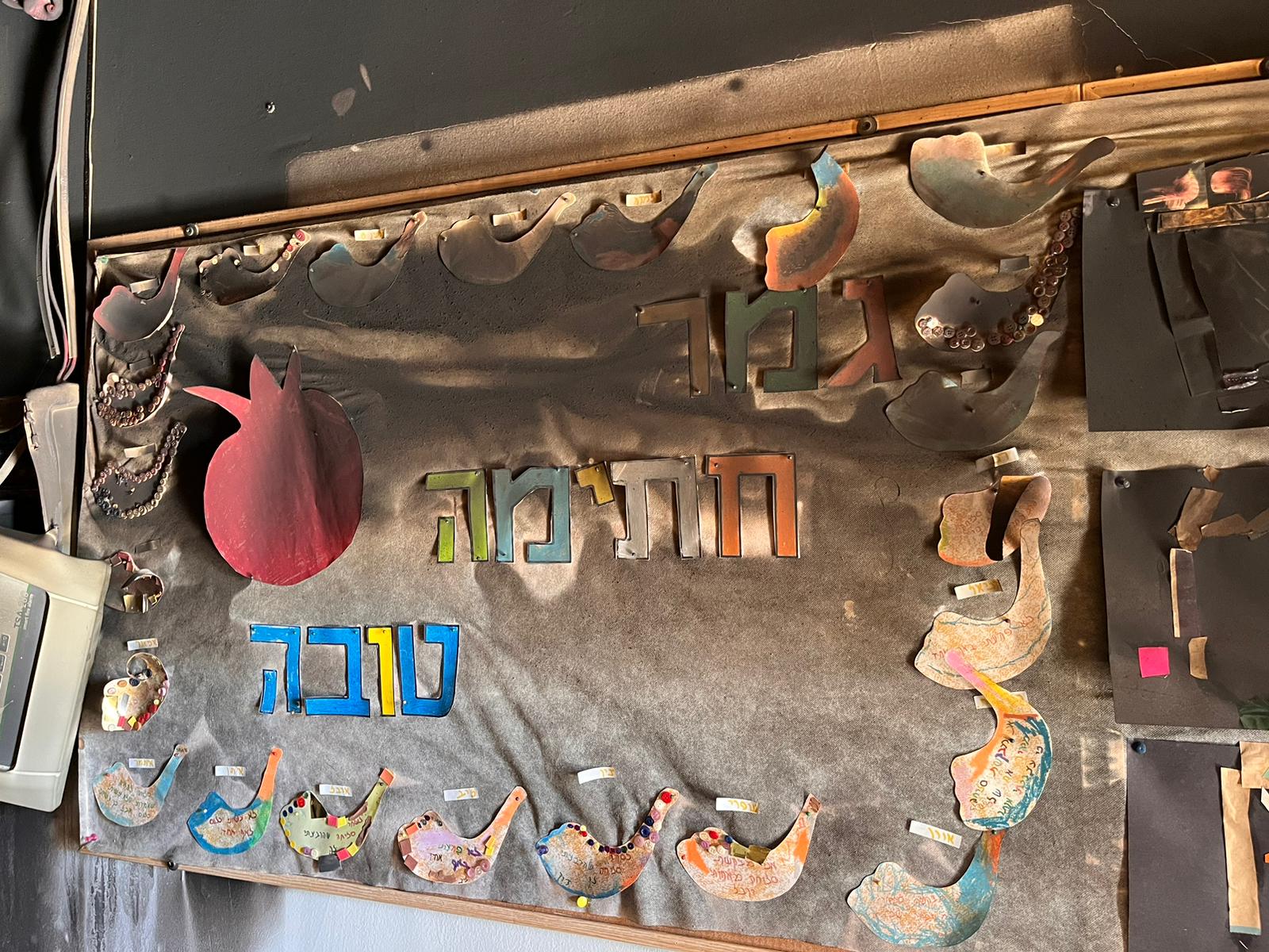 The scorched bulletin board and holiday decorations at the Tut Kindergarten on Kibbutz Nir Oz (Photo: Oren Dagan).
