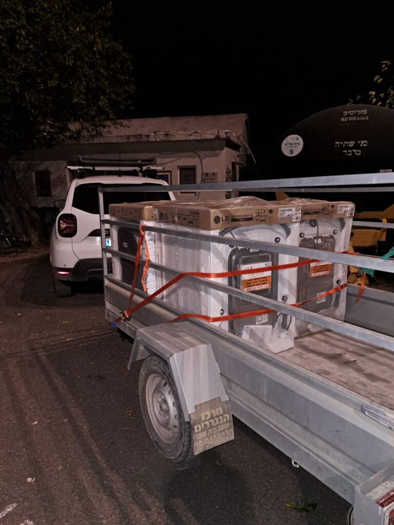 Transport of washing machines and dryers to Manara. (Photo: private album)