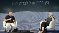 גילי בר סיני והרב מנחם קלמנזון (צילום: עופר עמרם, סל הפקות)