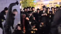 שוטר מכה חרדי מההתארגנות נגד הכנס בבית שמש (צילום: רשתות חרדיות לפי סעיף 27א לחוק זכויות היוצרים)