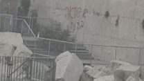 כתובת נגד המלחמה בעזה רוססה בחלקו הדרומי של הכותל המערבי (צילום: רשתות על פי סעיף 27א')